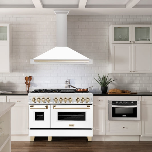 ZLINE Autograph Edition 48 in. Convertible Stainless Steel Range Hood with White Matte Shell and Polished Gold Accents (KB4STZ-WM48-G) in a luxury kitchen.