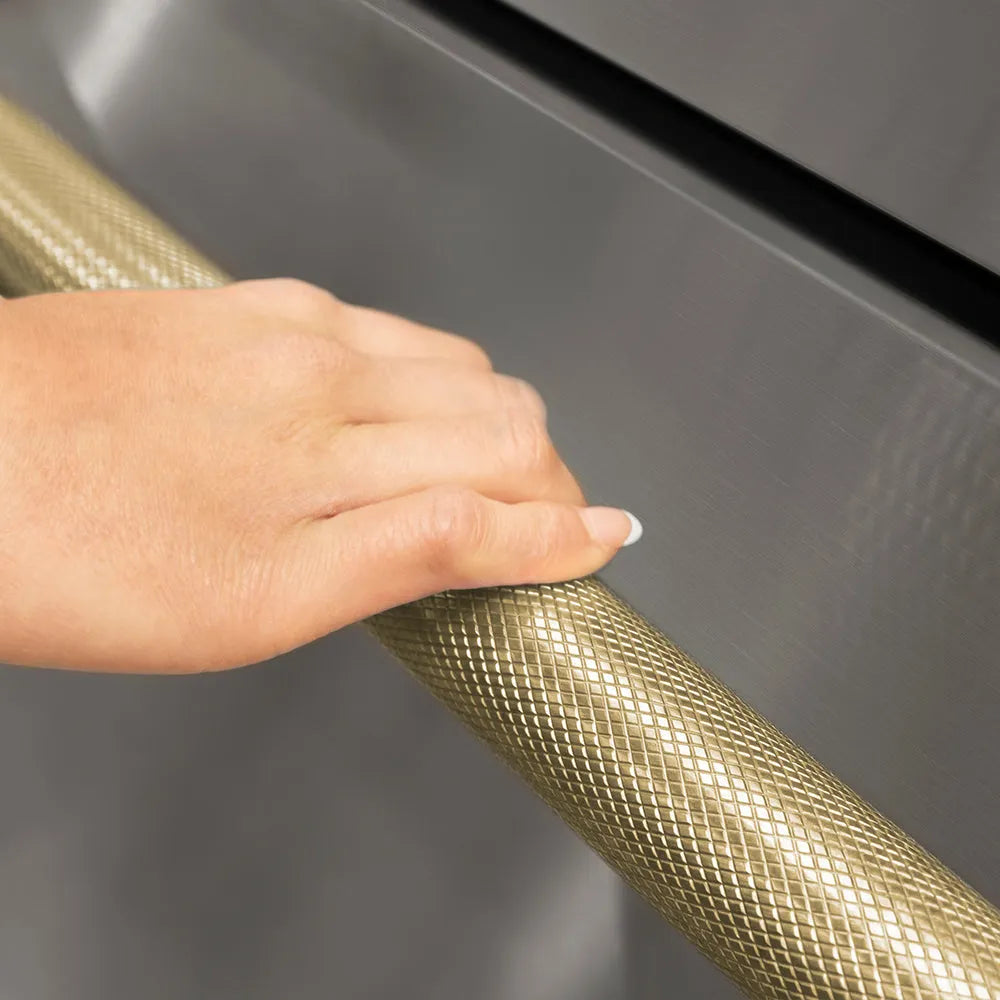 ZLINE Autograph Edition Touchstone Refrigerator Drawer Helix Handles (Set of 2) in Champagne Bronze (RDHOZ-24-K-CB) on appliance showing diamond knurled details.