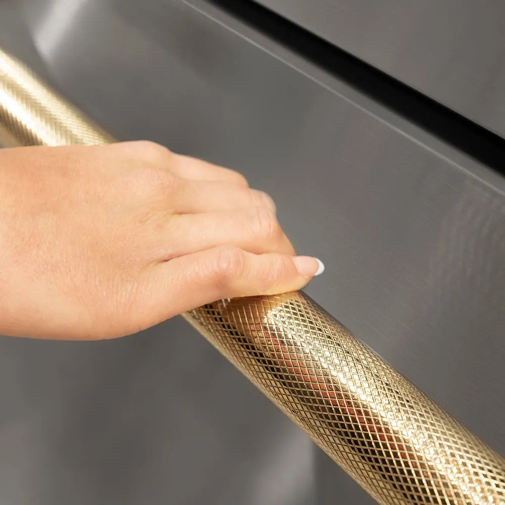 ZLINE Autograph Edition Touchstone Refrigerator Drawer Helix Handles (Set of 2) in Polished Gold (RDHOZ-24-K-G) on appliance showing diamond knurled details.