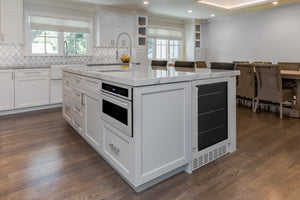 Modern kitchen with white island and ZLINE 24 in. Monument 154 Can Beverage Fridge in Stainless Steel (RBV-US-24)