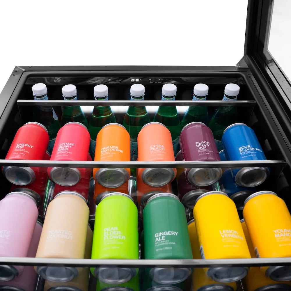Assorted cans of drinks in a ZLINE Autograph Edition 24 in. Monument 154 Can Beverage Fridge in Stainless Steel with Champagne Bronze Accents (RBVZ-US-24-CB)