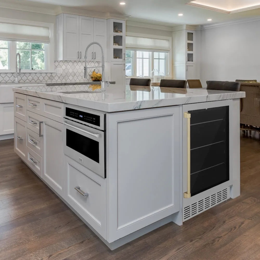 Modern kitchen with a marble island featuring ZLINE Autograph Edition 24 in. Monument 154 Can Beverage Fridge in Stainless Steel with Champagne Bronze Accents (RBVZ-US-24-CB)