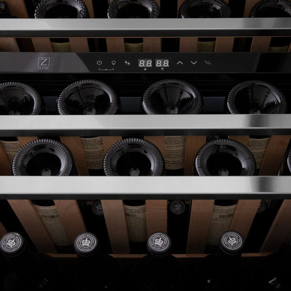 Wine bottles in ZLINE 24 in. Monument Dual Zone 44-Bottle Wine Cooler in Stainless Steel (RWV-UD-24) with digital display.