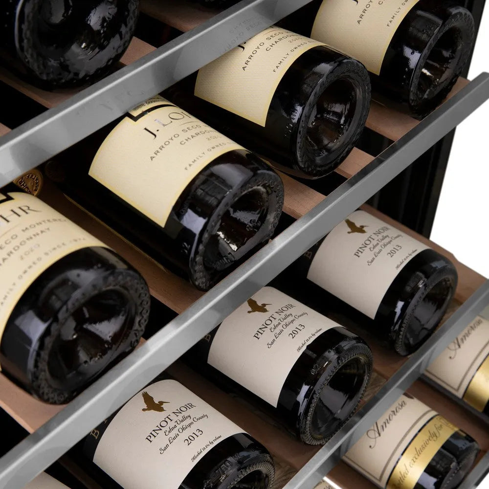 Wine bottles arranged in a ZLINE 24 in. Monument Dual Zone 44-Bottle Wine Cooler in Stainless Steel (RWV-UD-24)