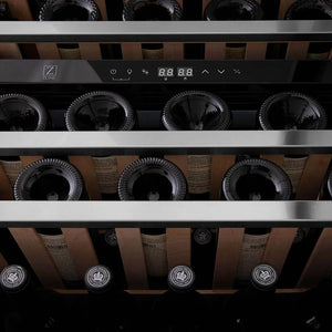 ZLINE Autograph Edition 24 in. Monument Dual Zone 44-Bottle Wine Cooler in Stainless Steel with Matte Black Accents (RWVZ-UD-24-MB) close-up, wine bottles one wooden shelves from below.