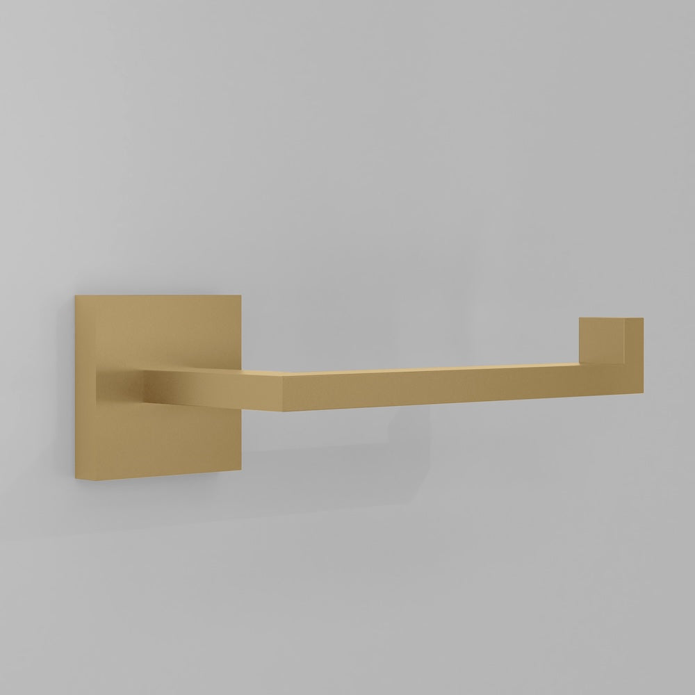 ZLINE Palisades Toilet Paper Holder in Champagne Bronze (RBCN1-TP-CB) on a gray wall.