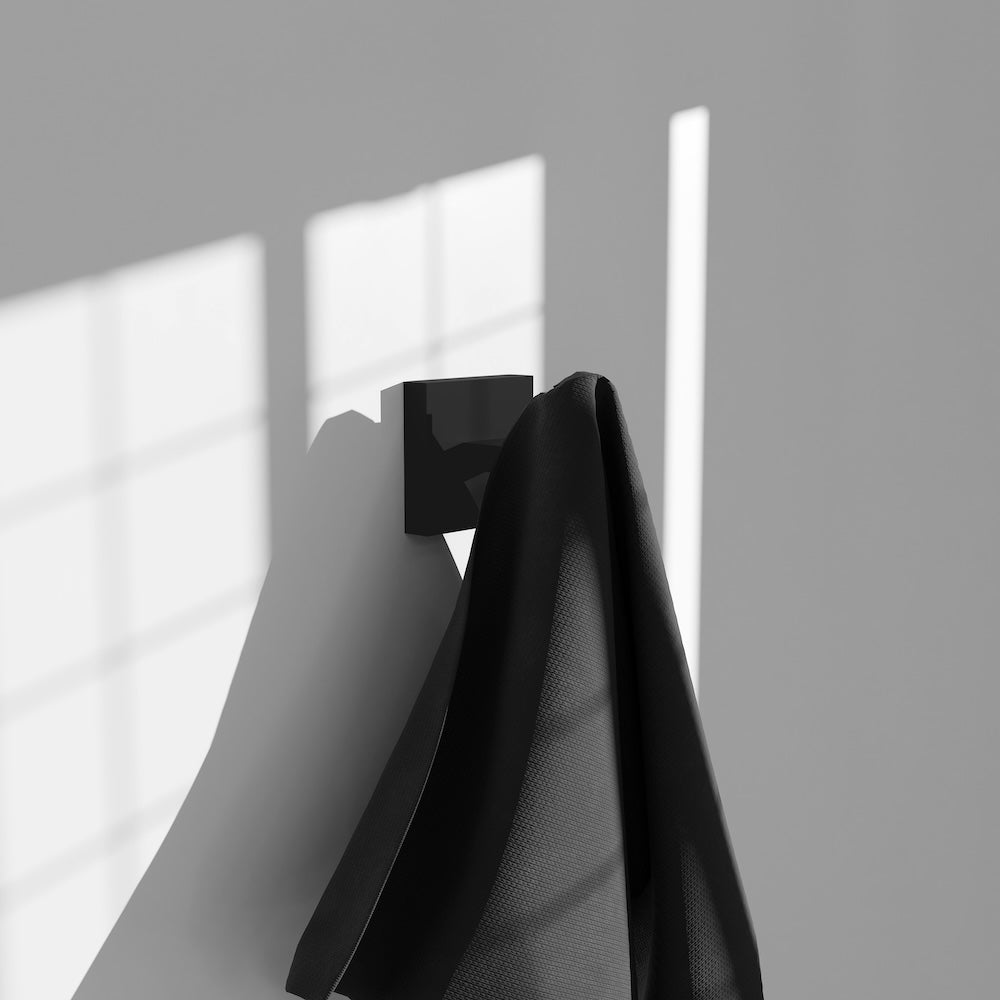 ZLINE Palisades Towel Hook in Matte Black (RBCN1-HK-MB) in a luxury bathroom, with towel.