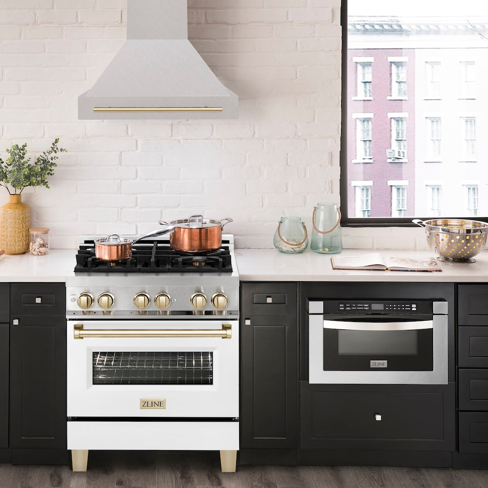 ZLINE Autograph Edition 30 in. Satin Stainless Steel Wall Mount Range Hood with Polished Gold Handle (8654SNZ-30-G) in a luxury kitchen.