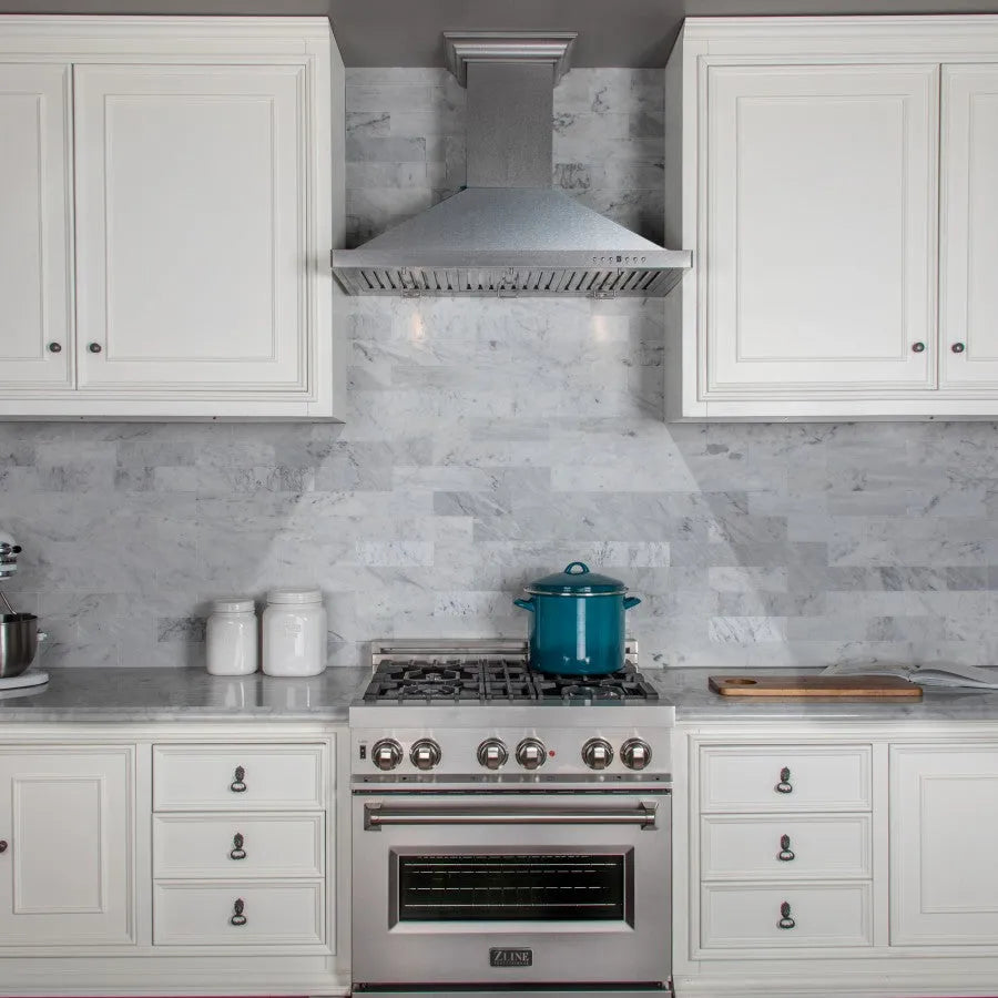 ZLINE 36 in. Designer Series Satin Stainless Steel Convertible Vent Wall Mount Range Hood (8KBS-36) in a luxury kitchen.