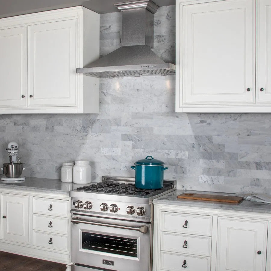 ZLINE 36 in. Designer Series Satin Stainless Steel Convertible Vent Wall Mount Range Hood (8KBS-36) in a luxury kitchen.