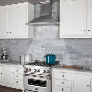 ZLINE 36 in. Designer Series Satin Stainless Steel Convertible Vent Wall Mount Range Hood (8KBS-36) in a luxury kitchen.