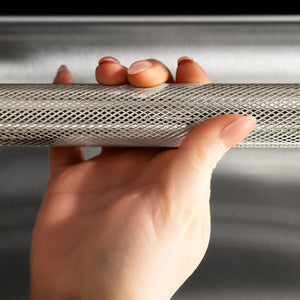 ZLINE Autograph Edition 24 in. Monument Series 3rd Rack Dishwasher with Auto Door Open Drying, 44dBa, Stainless Steel Panel with Polished Nickel Helix Handle (DWMTZ-30424-KPN) person holding Helix handle showing knurled diamond texture.