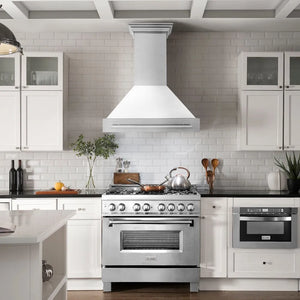 ZLINE 36 in. Satin Stainless Steel Wall Mount Range Hood with White Matte Shell and Stainless Steel Handle (8654SNX-WM-36) in a luxury kitchen.