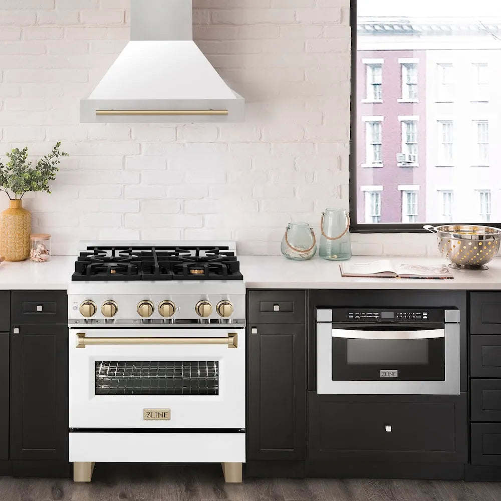 ZLINE Autograph Edition 30 in. Stainless Steel Range Hood with White Matte Shell and Champagne Bronze Handle in a luxury kitchen.