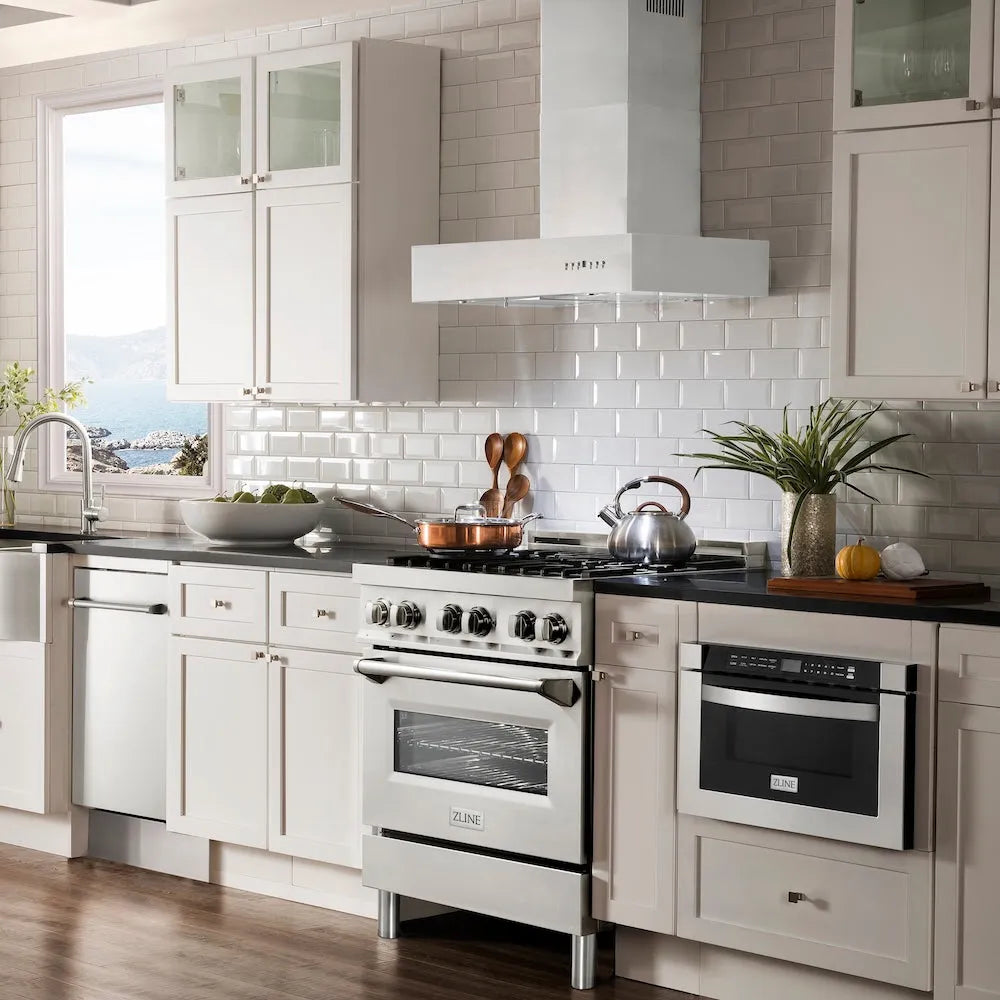 Farmhouse kitchen with ZLINE 30 in. Convertible Professional Wall Mount Range Hood in Stainless Steel (KECOM-30), white cabinets, stainless steel appliances, and a tiled backsplash.