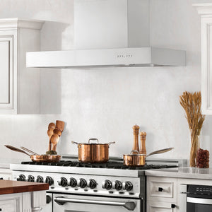 Farmhouse kitchen with ZLINE 36 in. Ducted Professional Wall Mount Range Hood in Stainless Steel (KECOM-36) above a stainless steel range with copper pots on the cooktop.