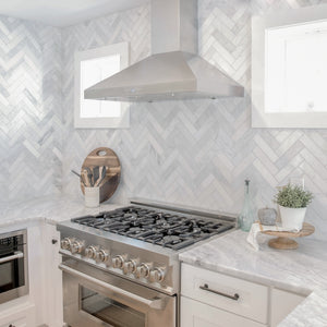 ZLINE 30 in. Convertible Vent Wall Mount Range Hood in Stainless Steel (KL3-30) in a kitchen with stainless steel range and chevron patterned backsplash