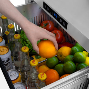 ZLINE 24 in. Touchstone 168 Can Outdoor-Rated Dual Refrigerator Drawer with White Matte Doors (RDSO-WM-24) close-up detail, reaching for an orange in top drawer.