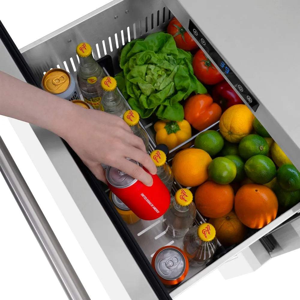 Open ZLINE 24 in. Touchstone 168 Can Outdoor-Rated Dual Refrigerator Drawer with White Matte Doors (RDSO-WM-24) with fresh produce and drinks inside, hand reaching for a can.