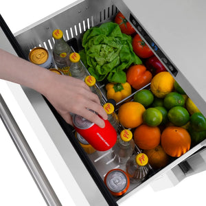 Open ZLINE 24 in. Touchstone 168 Can Outdoor-Rated Dual Refrigerator Drawer with White Matte Doors (RDSO-WM-24) with fresh produce and drinks inside, hand reaching for a can.
