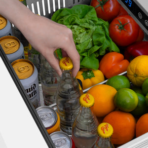 ZLINE 24 in. Touchstone 168 Can Outdoor-Rated Dual Refrigerator Drawer with White Matte Doors (RDSO-WM-24) close-up detail, reaching for a drink in top drawer.