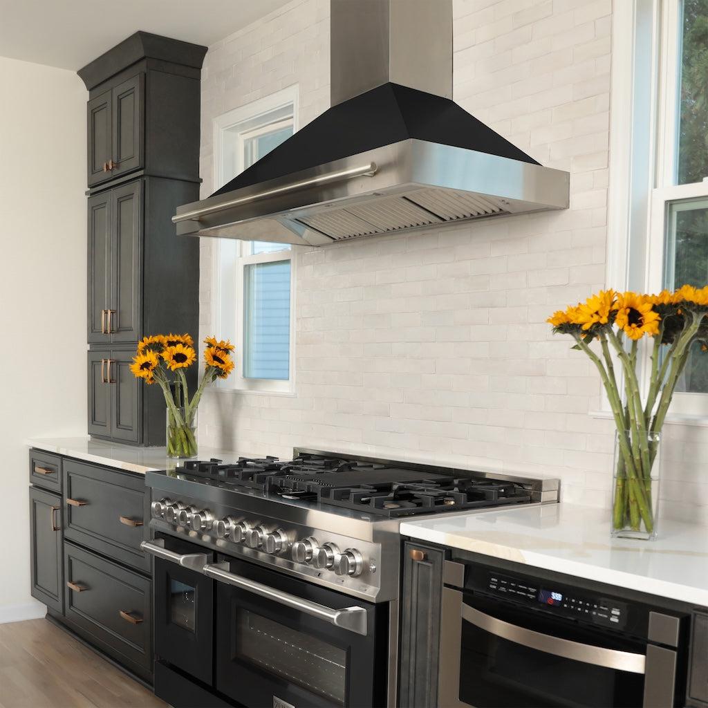 ZLINE Convertible Stainless Steel Range Hood with Black Matte Shell and Stainless Steel Handle (KB4STX-BLM) in a luxury kitchen with matching range and microwave.