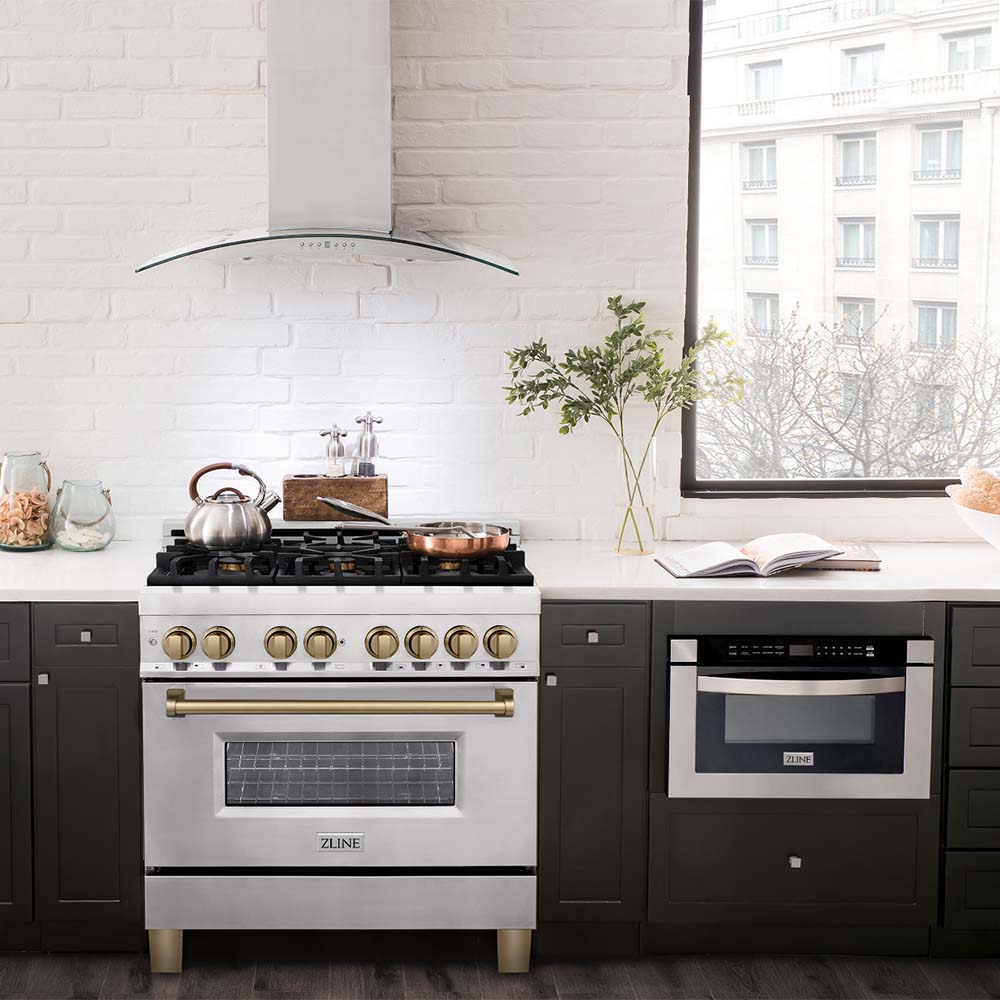 ZLINE Autograph Edition 36 in. 4.6 cu. ft. Dual Fuel Range with Gas Stove and Electric Oven in Stainless Steel with Champagne Bronze Accents (RAZ-36-CB) in a modern apartment kitchen.