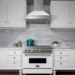 Farmhouse kitchen with white range, ZLINE 48 in. Ducted Satin Stainless Steel Wall Mount Range Hood with White Matte Shell (8654WM-48), and gray marble countertop.