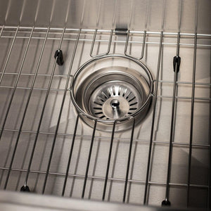 ZLINE Garmisch 27 in. Undermount Single Bowl Scratch Resistant Stainless Steel Kitchen Sink with Bottom Grid and Accessories (SLS-27S) close-up, basket strainer.