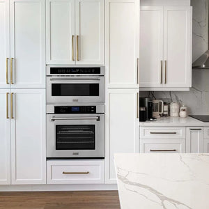 Microwave and wall oven combo in farmhouse-style kitchen.
