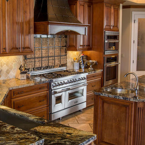 Rustic kitchen with stainless steel appliances, wooden cabinets, and a large rustic custom range hood using a ZLINE 46 in. Ducted Wall Mount Range Hood Insert in Stainless Steel (698-46).