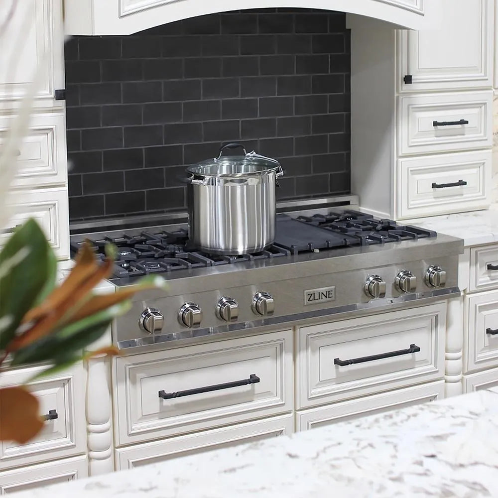 ZLINE 48 in. Legacy Gas Rangetop with 7 Burners and Porcelain Cooktop in Satin Stainless Steel (RTS-48) in a kitchen with black tiled backsplash and white cabinets.