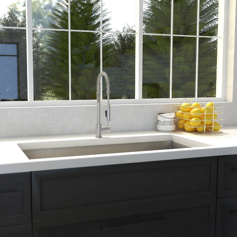 ZLINE Meribel 33 in. Undermount Single Bowl Stainless Steel Kitchen Sink with Bottom Grid (SRS-33) in a farmhouse-style kitchen, front.