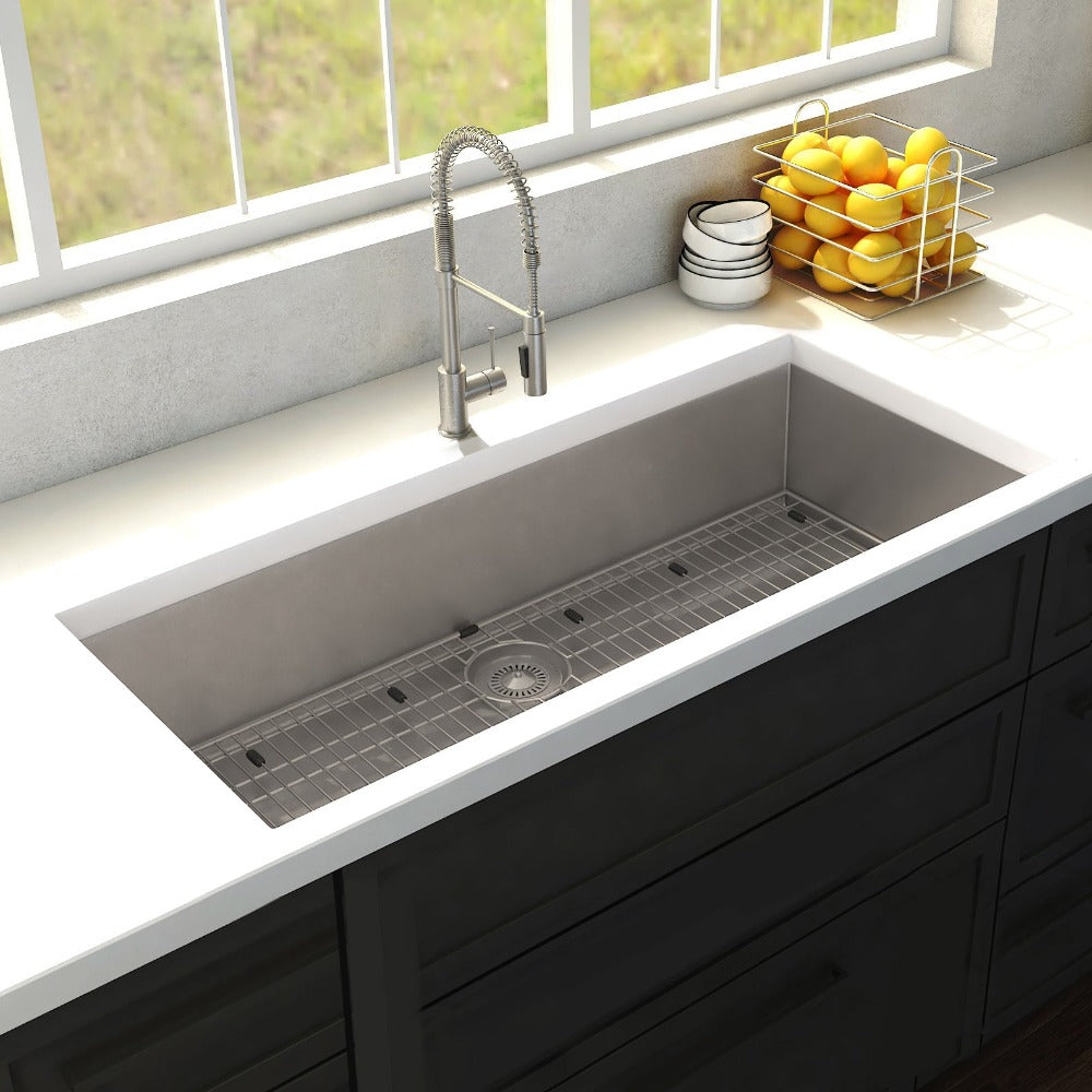 ZLINE Meribel 36 in. Undermount Single Bowl Stainless Steel Kitchen Sink with Bottom Grid (SRS-36) in a farmhouse-style kitchen, above.