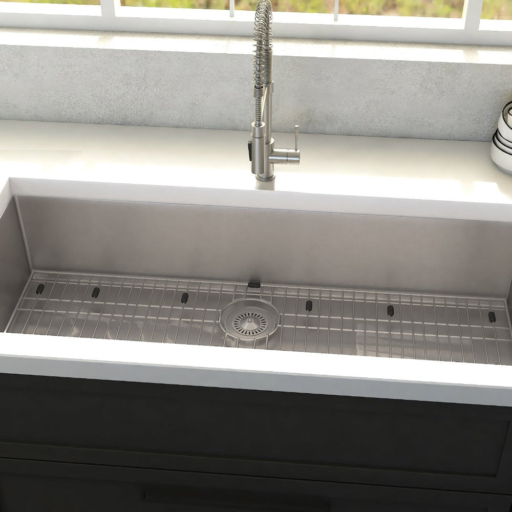 ZLINE Meribel 36 in. Undermount Single Bowl Stainless Steel Kitchen Sink with Bottom Grid (SRS-36) in a farmhouse-style kitchen, close-up.