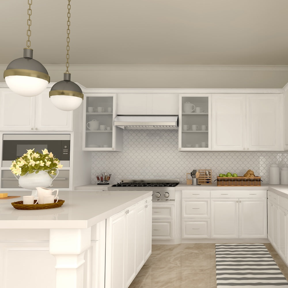 Modern kitchen with ZLINE 36 in. Ducted Under Cabinet Range Hood in Stainless Steel (623-36) white cabinets, gray countertops, and decorative elements.