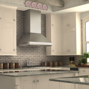 Modern kitchen with white cabinets, brick backsplash, and ZLINE 36 in. Professional Ducted Wall Mount Range Hood in Stainless Steel (687-36)