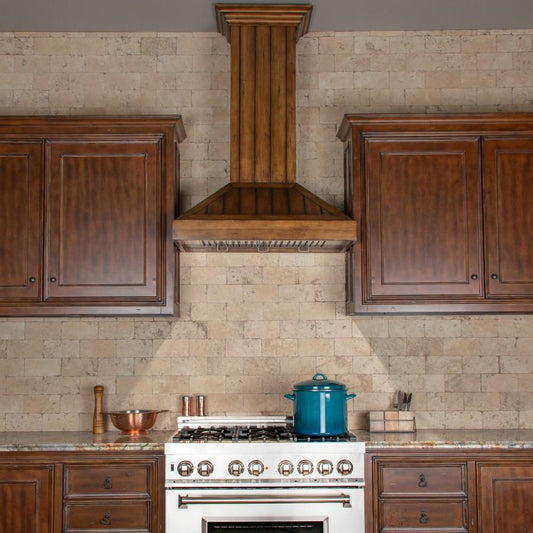 Kitchen with wooden cabinets, ZLINE 36 in. Wooden Wall Mount Range Hood in Rustic Light Finish (KPLL-36) stainless range, and a blue pot on the cooktop.