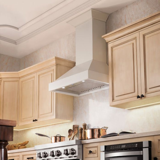 Kitchen with wooden cabinets, range, and ZLINE 30 in. Ducted Wooden Wall Mount Range Hood in Cottage White (KBTT-30).