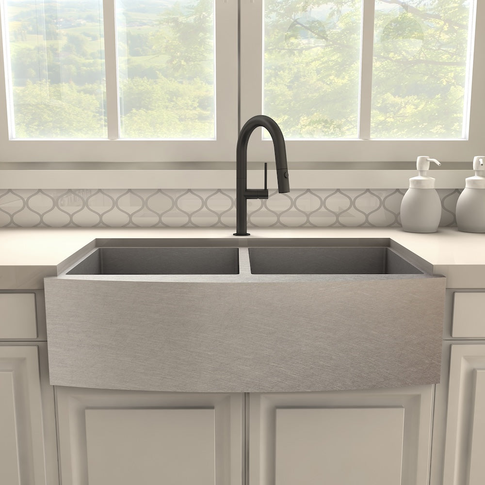 ZLINE Voltaire Pull Down Single Handle Kitchen Faucet in Matte Black (VLT-KF-MB) above a farmhouse sink in a kitchen setting