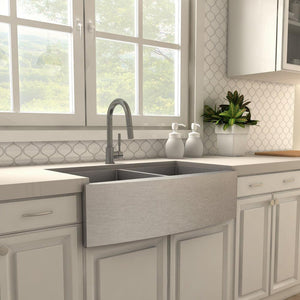 ZLINE Gemini Pull Down Single Handle Kitchen Faucet in Gun Metal (GEM-KF-GM) in a farmhouse kitchen, side.