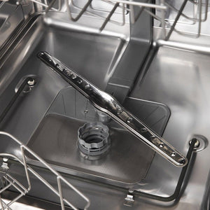 Bottom spray arm inside stainless steel dishwasher tub.
