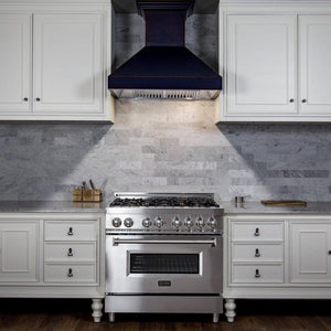 ZLINE Designer Series Wall Mount Range Hood in Oil-Rubbed Bronze (8667B) wide, in a luxury white kitchen.