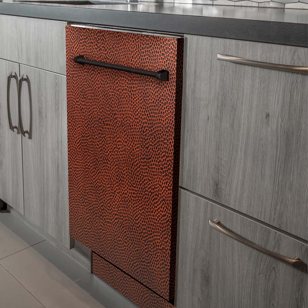 ZLINE 24 in. Top Control Dishwasher with Hand-Hammered Copper Panel and Traditional Style Handle, 52dBa (DW-HH-H-24) built-in to modern grey cabinets in a luxury kitchen.