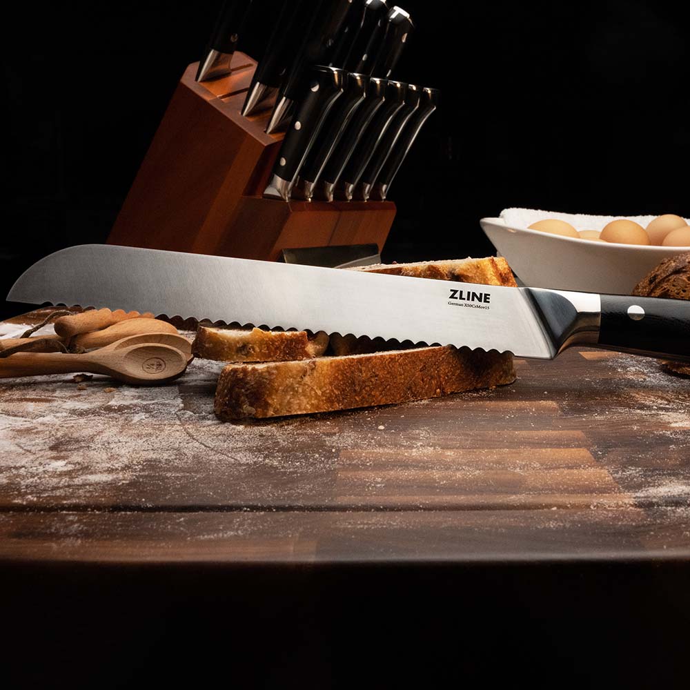 ZLINE German steel bread knife on cutting board with sourdough bread