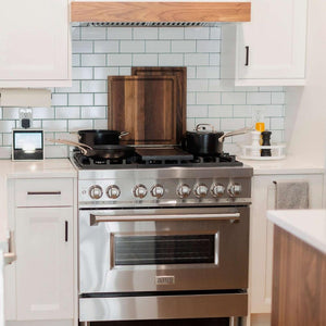 ZLINE 36 in. Dual Fuel Range with Gas Stove and Electric Oven in Stainless Steel (RA36) in a farmhouse-style kitchen.