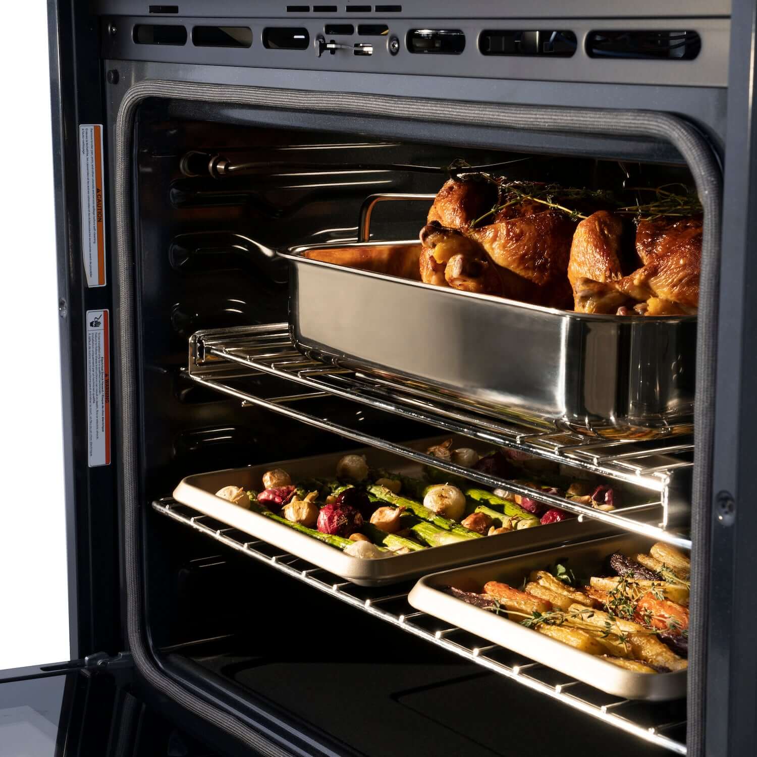 Close-up food cooking on top and bottom racks inside ZLINE Autograph Edition 30 in. Single Wall Oven with Self Clean and True Convection in Black Stainless Steel and Polished Gold Accents (AWSZ-30-BS-G)