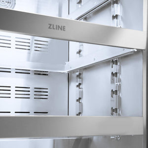 ZLINE Autograph Edition 24 in. Touchstone 151 Can Beverage Fridge With Stainless Steel Glass Door And Polished Gold Handle (RBSOZ-GS-24-G) front, middle full-extension glass racks with ZLINE logo close up.