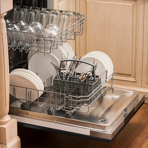 Built-in top control dishwasher with dishes and utensils on bottom rack and glassware on top rack