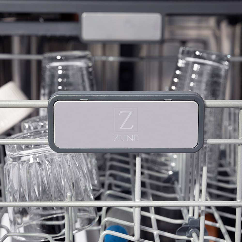 ZLINE Autograph Edition 24 in. 3rd Rack Top Touch Control Tall Tub Dishwasher in White Matte with Polished Gold Accent Handle, 45dBa (DWMTZ-WM-24-G) close-up, logo on dish rack.